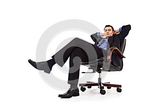 Businessman relaxing in armchair