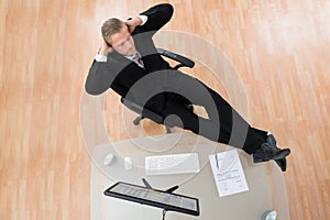 Businessman Relaxing On Chair