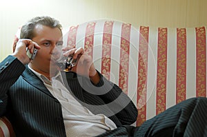 Businessman relaxing on sofa