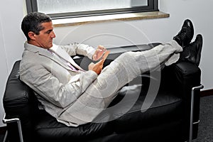 Businessman relaxing with your smartphone