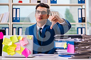 The businessman with reminder notes in multitasking concept