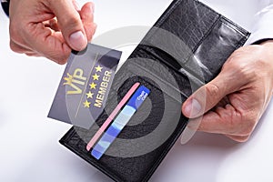 Businessman Removing VIP Card From Wallet