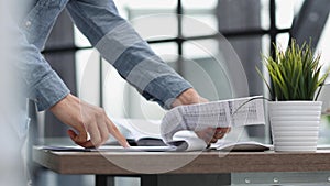 businessman reviewing document reports at office workplace