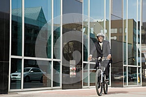 Businessman riding bicycle