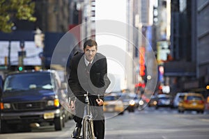 Businessman Riding Bicycle To Work