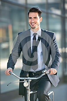 Businessman riding a bicycle to work
