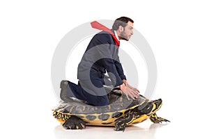 Businessman riding a turtle