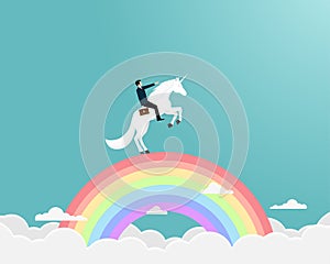 Businessman riding a unicorn on rianbow
