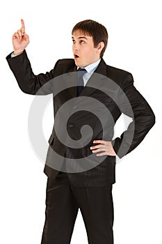 Businessman with rised finger. Idea gesture. photo