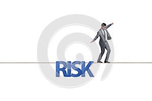 Businessman in risk concept walking on tight rope