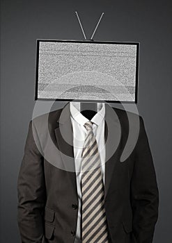 Businessman with rmpty tv head on dark background