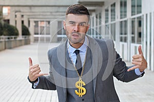 Businessman rocking golden necklace with dollar sign