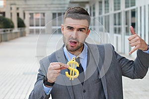 Businessman rocking golden necklace with dollar sign