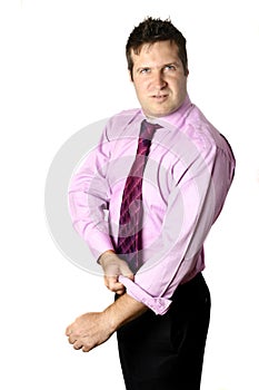 Businessman rolling up his sleeves