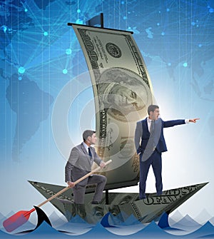 The businessman rowing on dollar boat in business financial conc
