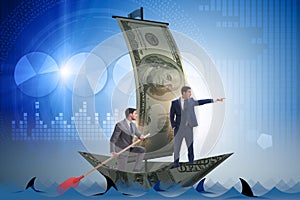 The businessman rowing on dollar boat in business financial concept