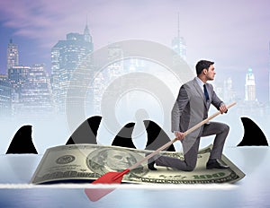 Businessman rowing on dollar boat in business financial concept