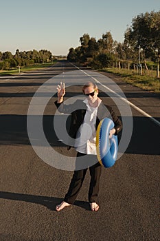 Businessman with rubber ring waving