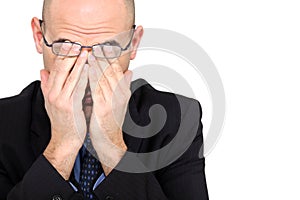 Businessman rubbing his eyes