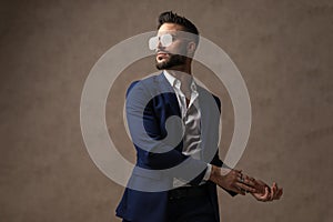 Businessman rubbing his palms to the side