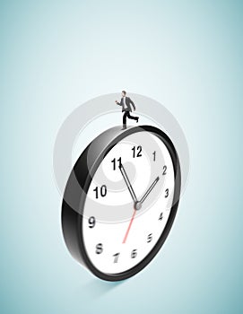 Businessman runing on clock photo