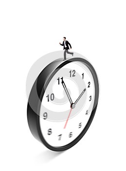 Businessman runing on clock photo