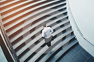 Businessman running fast upstairs Growth up Success concept