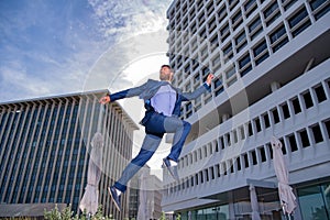 Businessman running, jumping. Concept of fast business with running business man. To stay on top.