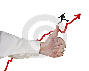 Businessman running and jumping on growing red arrow with thumb