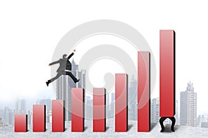 Businessman running, jumping on red bar chart another hold one