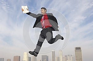 Businessman Running In Midair photo