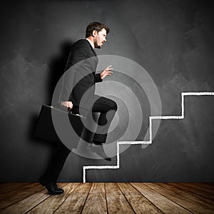 Businessman running the symbolic career stairs