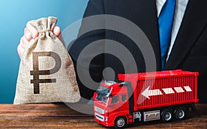 Businessman with russian ruble money bag and truck. Good salaries for drivers. High income of the transport business and the