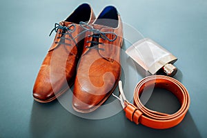 Businessman`s accessories. Brown leather shoes, belt, perfume. Male fashion. Businessman