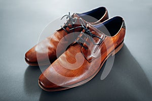 Businessman`s accessories. Brown leather shoes, belt, perfume. Male fashion. Businessman