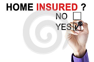 Businessman`s hand approving home insured