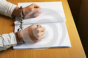 Businessman's Hand In Handcuffs