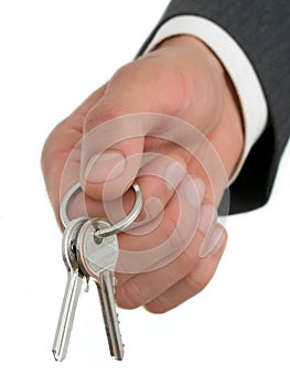 Businessman's Hand Holding Keys