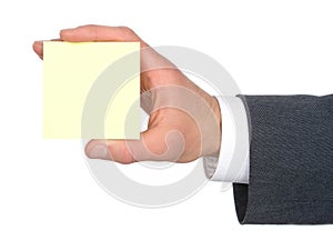 Businessman's Hand Holding Yellow Post-It