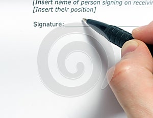 Businessman's hand signing papers. Lawyer, realtor, businessman