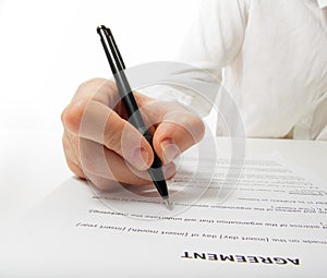 Businessman's hand signing papers. Lawyer, realtor, businessman