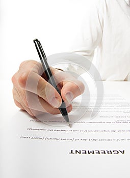 Businessman's hand signing papers. Lawyer, realtor, businessman