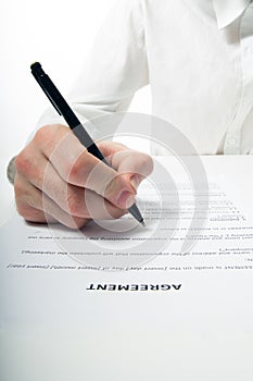 Businessman's hand signing papers. Lawyer, realtor, businessman