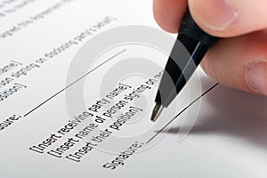 Businessman's hand signing papers. Lawyer, realtor, businessman