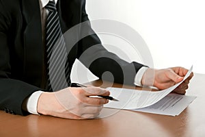 Businessman's hand signing papers. Lawyer, realtor, businessman