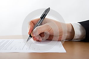 Businessman's hand signing papers. Lawyer, realtor, businessman