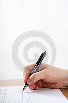 Businessman's hand signing papers. Lawyer, realtor, businessman