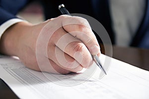 Businessman's hand signing papers. Lawyer, realtor, businessman