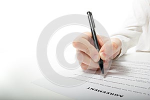 Businessman's hand signing papers. Lawyer, realtor, businessman