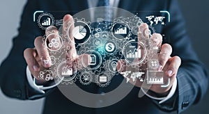 Businessman interacting with futuristic digital interface and technology icons hand gestures